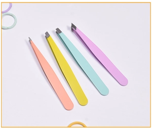 Set of four colorful stainless steel eyebrow tweezers with slanted tips on white background