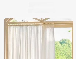 Close-up of white lace curtain with fine vertical stripes and scalloped wave edge detail