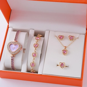 Elegant rose gold jewelry set including watch, necklace, and ring in premium gift box
