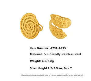 Detail of vintage gold leaf pattern and spiral texture on eco-friendly stainless steel rings