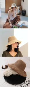 Detail von Stroh-Sonnenhüten mit Fransenrand in Khaki und Beige für den Sommerurlaub