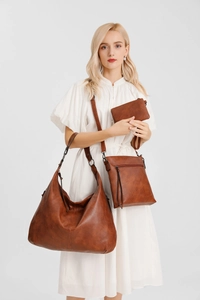 Three-piece brown retro hobo bag set including shoulder bag and crossbody pouch on model