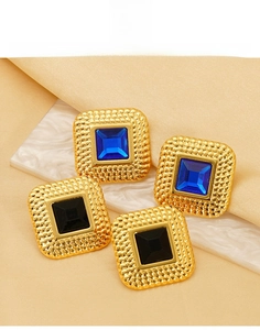 Detailed close-up of vintage square titanium steel earrings with blue zircon stones