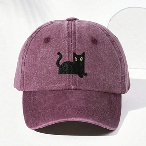 Close-up of black cat embroidery on a washed cotton burgundy baseball cap for kids