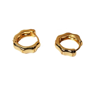 Minimalist gold plated brass bamboo hoop earrings with polished finish on white background