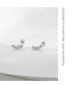 Macro shot of silver plated curved stud earrings featuring tiny micro-pave cubic zirconia