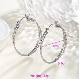 Detailed view of silver hoop earrings with chain texture, 4cm diameter and 7.32g weight