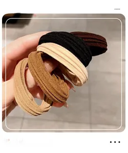 Close-up of thick high-elasticity hair ties showing durable fabric texture and colors