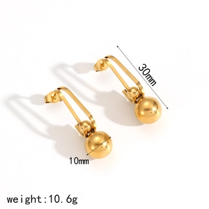 Macro detail of 18k gold plated 30mm tassel ball earrings with 10mm sphere dimension