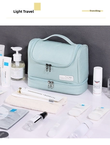 Detail of mint green toiletry bag with double-layer design and metal zipper closure