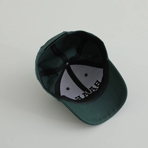 Detail view of cotton baseball cap interior showing black sweatband and stitching