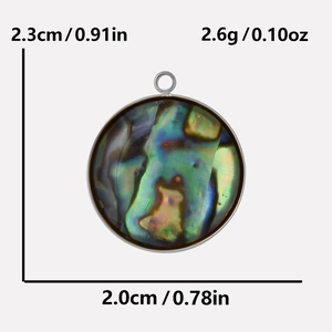 Detail of oval abalone shell pendant showing size 2.3cm x 2.0cm and weight 2.6g