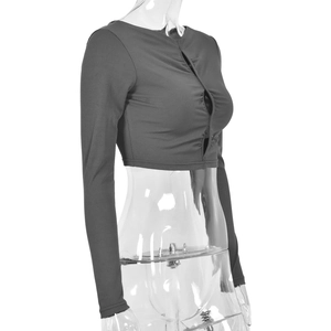 Detail of dark grey ribbed long sleeve crop top featuring a sexy cutout chest design