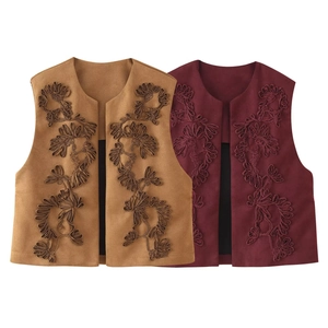 Embroidered vintage suede vests in tan and burgundy featuring detailed floral patterns