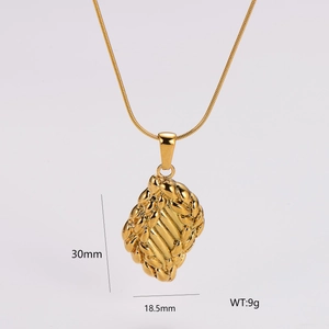 Detailed view of woven leaf pendant with 30mm height and 18.5mm width on gold snake chain
