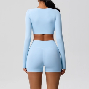 Sky blue long-sleeved yoga top and high-waisted shorts set shown from a back view