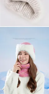 Detail of warm pink knit hat and neck gaiter set with plush white faux fur trim