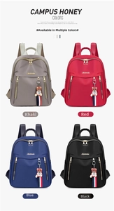 Four colors of women's nylon backpacks featuring decorative teddy bear charms and gold zippers