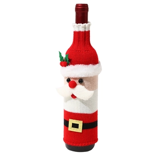 Knitted Santa Claus wine bottle cover with red festive hat and white beard decoration