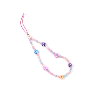 Detailed view of colorful handmade acrylic beads and resin flowers on mobile strap