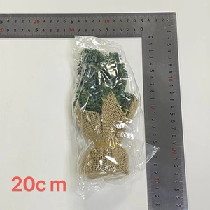 Detailed view of 20cm mini artificial Christmas tree with burlap base and scale ruler