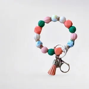 Colorful pumpkin silicone bead wristlet keychain with pink tassel and gold ring