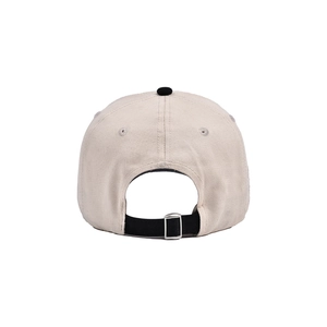 Detail view showing the adjustable black back strap and metal buckle of the baseball cap