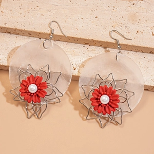 Detail of shell round flower earrings with silver wire and white pearl accent