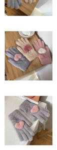 Detailed view of fleece knit gloves with heart patterns and touchscreen fingertips