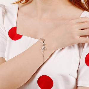Elegant stainless steel heart and cat paw charm bracelet with heartbeat line on wrist
