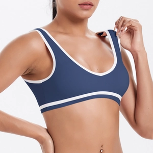 Brassière de sport yoga moulante bleu marine avec bordures contrastées blanches et col en V