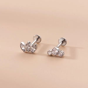 Detail of 16G stainless steel labret studs with marquise and round zircon clusters