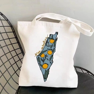White canvas tote bag featuring an orange map illustration and Free Palestine text