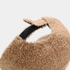 Close-up of the adjustable strap on a warm caramel fleece baseball cap back view