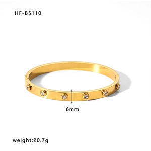 Detailed view of 6mm wide 18k gold plated stainless steel bangle with crystal inlay