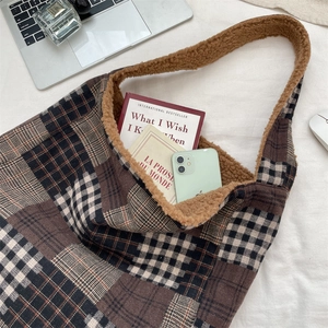 Detailed view of checkered tote bag with lamb wool lining and large storage capacity