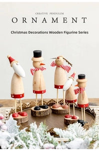 Close-up of five wooden Christmas figurines on tree slice bases in a rustic tray
