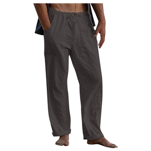 Detail of dark gray linen drawstring pants featuring elastic waistband and cuffed ankles