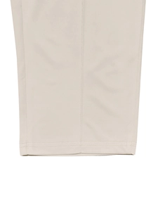 Detail shot of double-stitched hem on beige men's leisure pants with precise craftsmanship