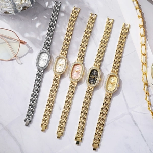 Montre à quartz élégante pour femme avec lunette ovale en diamant et bracelet en métal doré
