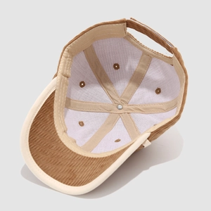 Detail of corduroy baseball cap showing white cotton lining and reinforced stitching