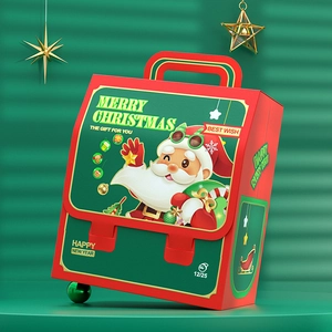 Christmas suitcase gift box with Santa Claus print and red handle in festive setting