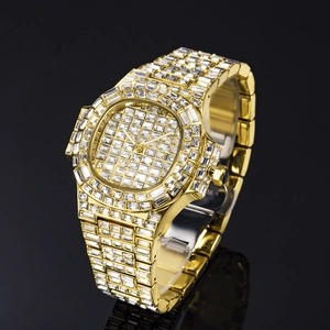 Detailed macro shot of gold square-cut crystal encrusted watch dial and bezel on black background
