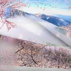Close-up of bohemian tapestry showing high-definition print of snow mountains and cherry blossoms