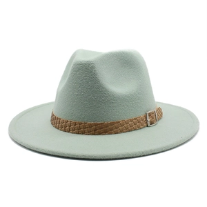 Detail of mint green wool fedora hat featuring a woven brown leather band with metal buckle