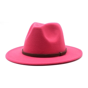 Detail of a bright rose pink wool felt fedora featuring a brown braided leather band