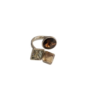 Three-stone open ring with oval brown and square green cubic zirconia in silver finish
