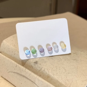 Set of 6 colorful round stud earrings with opal texture on a white display card