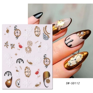 Detail of 3D embossed gold and black New Year clock nail stickers with snowflake patterns