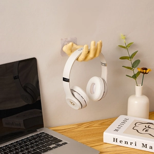 Creative hand-shaped adhesive wall hook for organizing keys and headphones on office desk